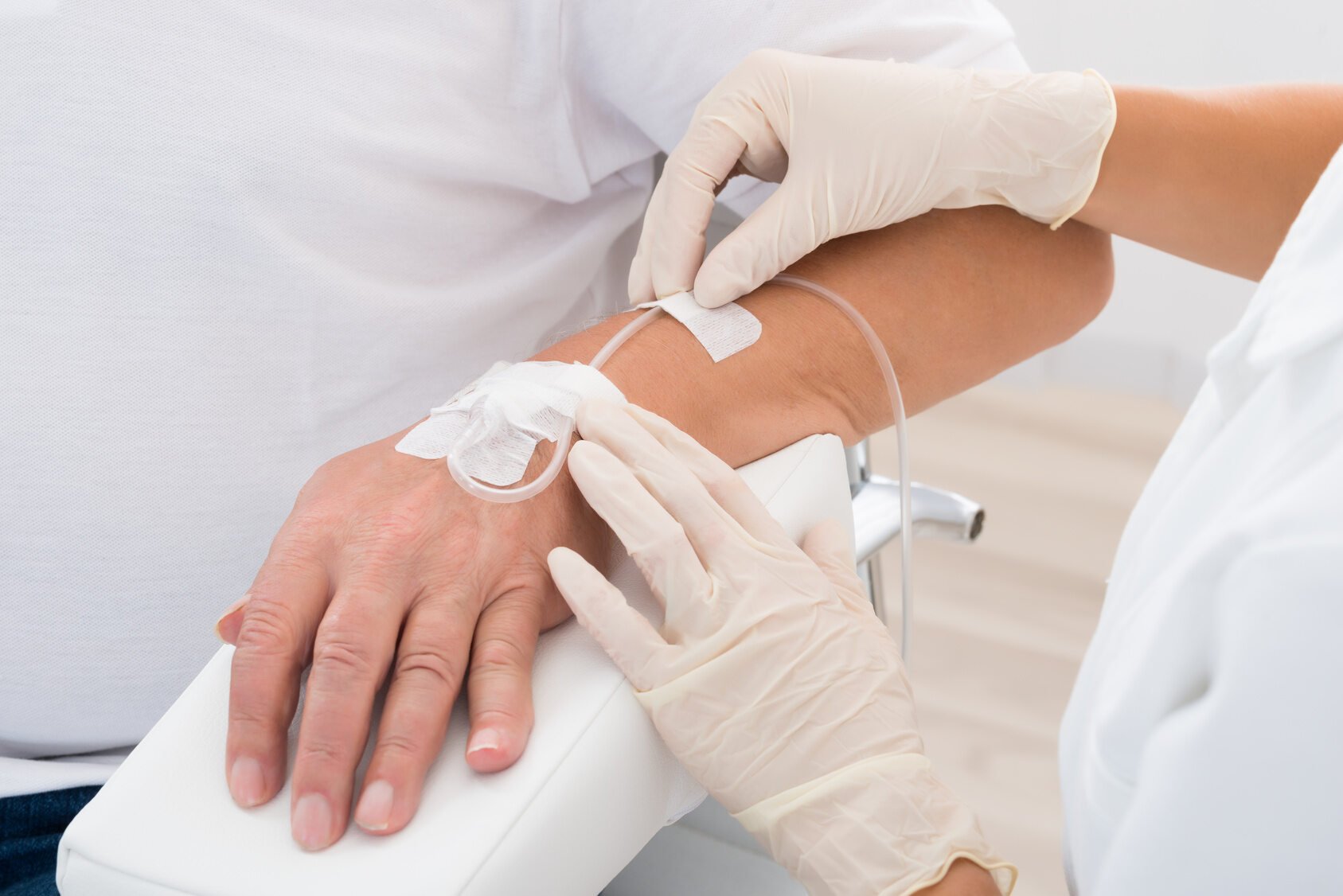 Nurse Administering IV Drip Nurse Administering IV Drip